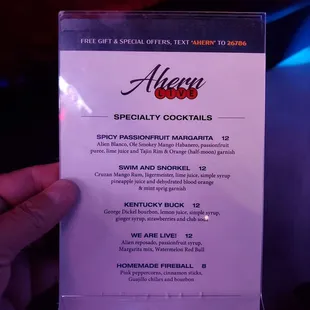 a person holding a menu