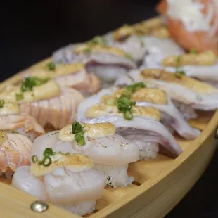 Various orders of sushi, from scallops, onion salmon, aburi salmon and hamachi sushi *11/12/24