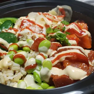 Regular bowl with spicy salmon, spicy ahi tuna, crabmeat, jalapeños, green onions, edamame, and ginger, topped with hot sauce and spicy mayo