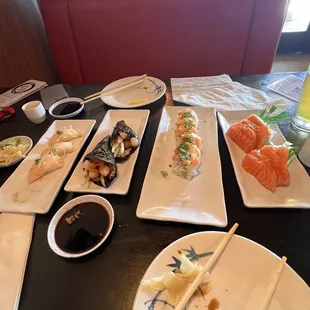 plates of sushi and chopsticks