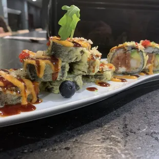 a plate of sushi on a counter