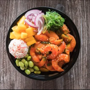 a bowl of food on a wooden table