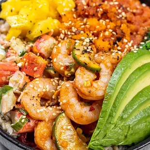 a bowl of shrimp, rice, and vegetables
