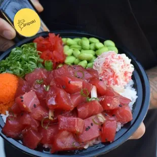 a man holding a bowl of food