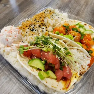 a plastic container with rice and vegetables