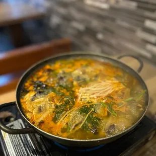 a pot of soup on a stove