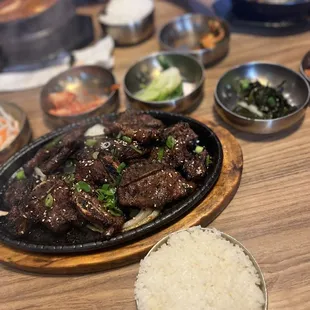 a plate of beef and rice