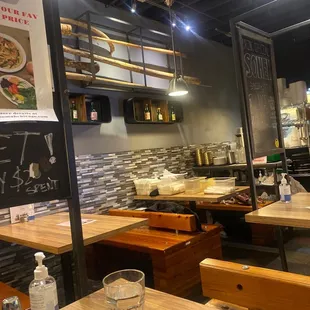 a restaurant with wooden tables and benches