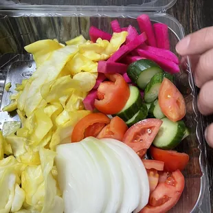 Pickled cabbage and pickled turnips with sliced cucumbers