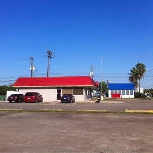 a car parked in front of a gas station