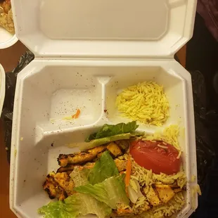 a meal in a styrofoam container