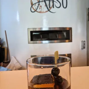 View from the chef's counter with a Black Manhattan! I recommend both!