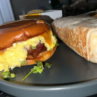 Bacon, Egg and Cheese on brioche and a huge egg burrito