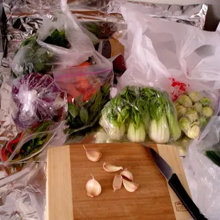 Good gotten gains . . . bok choy, thai peppers, cabbage, brussels sprouts, thai basil, garlic
