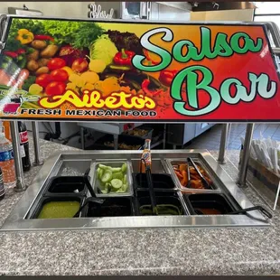 Salsa Bar, Red, green, and avocado   also carrots, radishes, and cucumber.