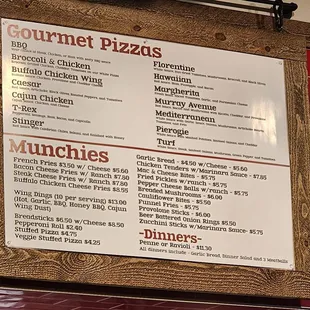 Gourmet Pizza/Munchies/Dinners Menu above counter.