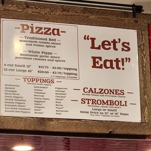 Pizza Menu above counter.