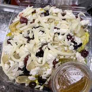 Aiellos salad w/ house made Italian dressing!  (Tomato,onion,black olive, katamala olives, artichoke hearts, feta AND provolone cheese)
