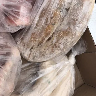 a cardboard box filled with bags of food