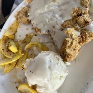 Chicken friend steak with yellow squash.