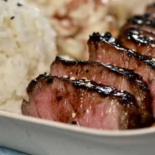 a plate of meat and rice