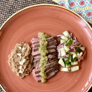 Carne Asada with Salsa Verde paired with Cucumber Salad and Refried Pinto Beans