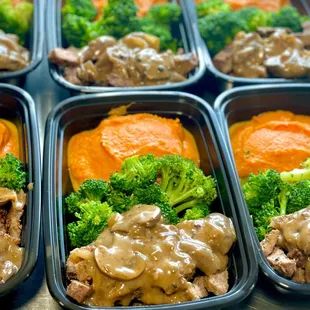a close up of a meal of meat, broccoli, and carrots