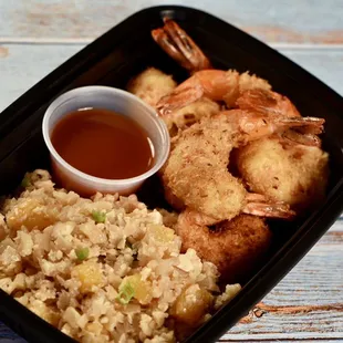 Coconut Shrimp w/ cauliflower rice available through our meal prep services