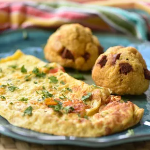 Veggie Omelette and Bolon (baked plantain filled with goat cheese and organic sausage)