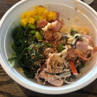 Poke bowl Spicy salmon, tuna, seaweed salad, crab meat, mango, spicy mayo, ponzu.