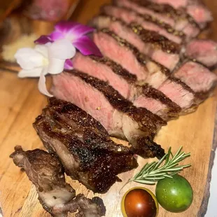 Prime Ribeye 32oz  Yuzu salt  Red wine rosemary salt Wasabi salt  Chocolate , Rosemary garnish &amp; edible flowers   SO ONO ! NO JOKE !