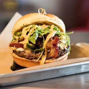 a closeup of a burger on a tray