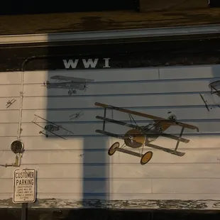 an airplane painted on the side of a building