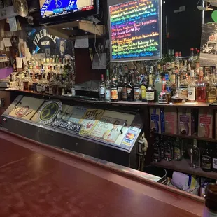 a bar with a variety of liquors