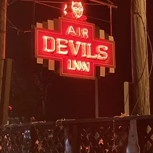 a neon sign for a bar