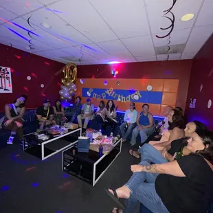 a group of people sitting in a room