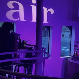 a bar with purple lighting