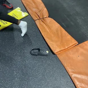 Broken trampoline with caution sign