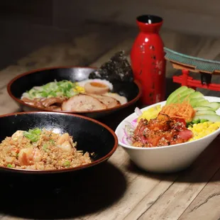 three bowls of food on a table