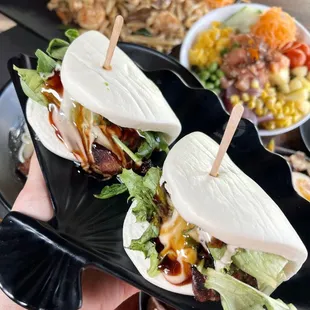 a person holding a plate of food