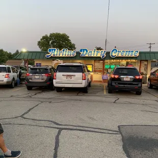 a man walking in front of a restaurant