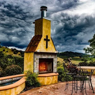 a patio with a fire place