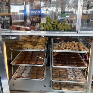 delicious fresh donuts, croissants, apples &amp; bananas