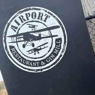 Airport restaurant and Gin Mill logo
