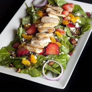 STRAWBERRY CHICKEN SALAD Grilled chicken breast, baby spinach, strawberries, mandarin oranges, dried cranberries, candied pecans, red onions