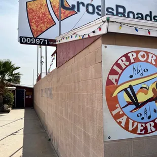 a sign for the airport tavern