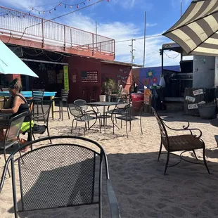tables and chairs on the beach