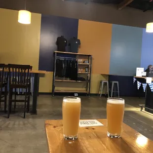 two glasses of beer on a table