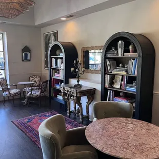a living room with a table and chairs
