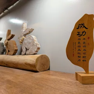 Definitely Taiwanese-owned.  That Taiwan-shaped wood carving, though?  The inscription has major MLM motivational speech vibes...